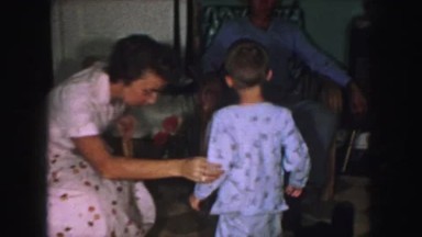1958: a father is seen playing with children AMES, IOWA