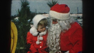 1958: beautiful christmas papa and kid engaged in chat on roadside AMES, IOWA