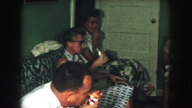 1958: throwing back some drinks and smoking around the christmas tree