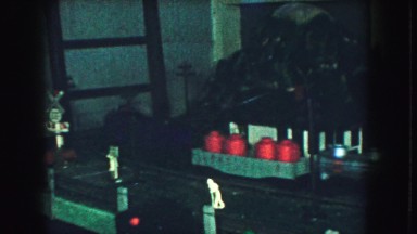 1958: a small toy train set circling around a decorated table top AMES, IOWA