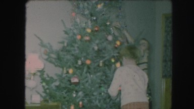 1958: children decorating a variety of christmas trees AMES, IOWA