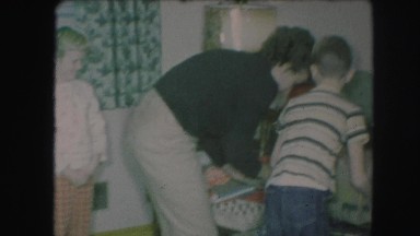 1958: family decorating the christmas tree AMES, IOWA
