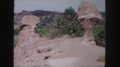 1958: rock formation in color with trees in the background COLORADO