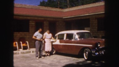 1958: people standing outside preparing to get into a classic car COLORADO