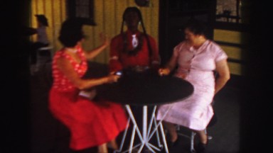 1958: two women and a dummy sitting a a table. COLORADO