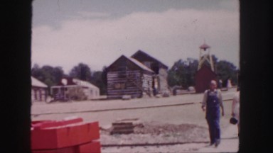 1958: people are walking down the sidewalk in a small town. COLORADO