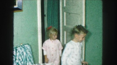 1958: children waking up early on christmas day to open their presents AMES