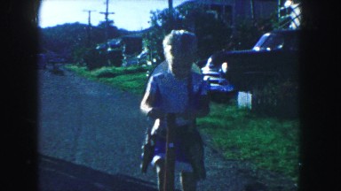1958: children playing and driving some traditional handmade cars AMES, IOWA