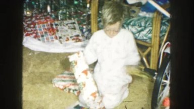 1958: christmas morning, kids opening presents AMES, IOWA