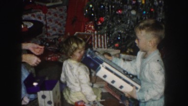 1958: children are seen around a christmas tree AMES, IOWA