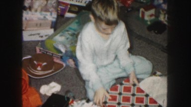 1958: boy opening christmas presents AMES, IOWA