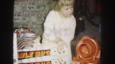 1958: child opens his table bug gift christmas present toy and is extremely