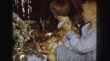 1958: two small children on a christmas morning play
