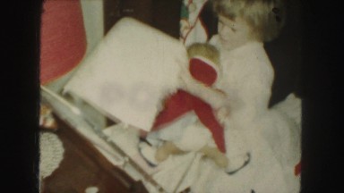 1958: the funny girl in white frock putting her doll in the trolley AMES, IOWA