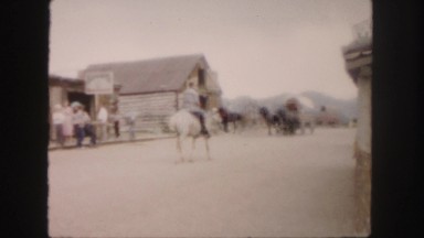 1958: gunfight in frontier town on road used by horses, riders