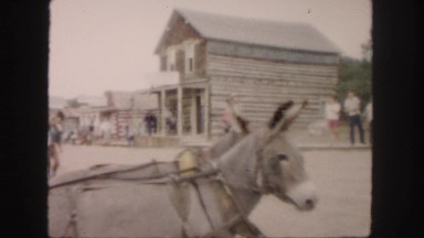 1958: cowboys entertaining in the street of a western theme park COLORADO