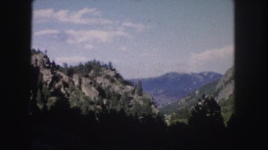 1958: a beautiful mountain ridge as seen through the window of a moving vehicle
