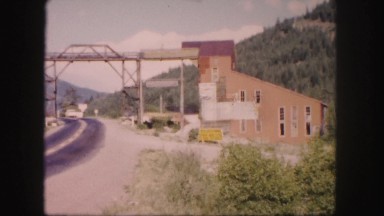 1958: train track leading to ore processing building COLORADO