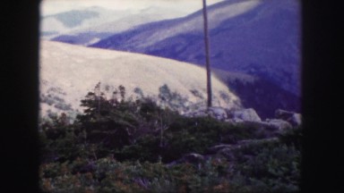 1958: a beautiful snow covered mountain ridgeline as seen through the window