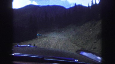 1958: a rugged dirt road cutting through the mountains