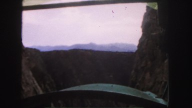 1958: a beautiful view of mountains as seen from the window of a moving train