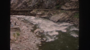 1958: a group of people watching flow of river COLORADO