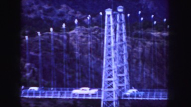 1958: a bridge is seen from a mountain area with greenery and trees COLORADO