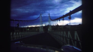 1958: stopping to enjoy the overcast view before driving across a massive bridge