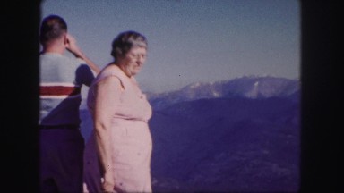 1958: people are seen in a tourist area and are observing a building COLORADO