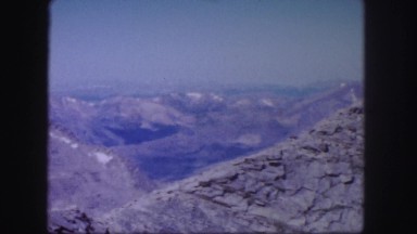 1958: a rugged mountain top with crevices filled with snow COLORADO