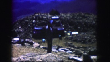 1958: a man on the rocky side of a hill smoking a cigarette COLORADO