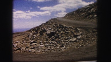 1958: curving road cutting through mountainous slope at high elevation COLORADO