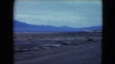 1957: driving through the valley on a sunny day DEATH VALLEY, CALIFORNIA