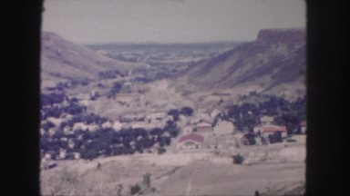 1958: car is moving along the serpentine road around the hill COLORADO