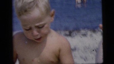 1958: A Dad Feeding His Little Boy an Ice Cream Cone on the Beach New York City