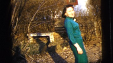 1958: woman wearing turquoise dress smiling before prom NEW YORK CITY