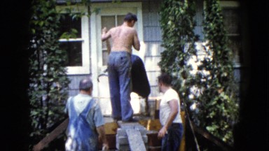 1960: the worker pouring down the concrete mixture from the trolley WAUCONDA