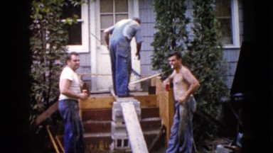 1960: construction workers fixing the front stairway up to the house WAUCONDA