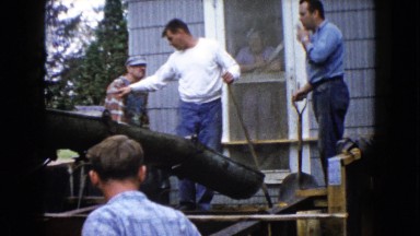1960: Outdoor Industrial Scene in Wauconda, Illinois with Workers and Forklift