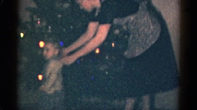 1959: Mother Helps Children Decorate Christmas Tree with Illumination at Catskill Game Farm