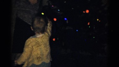 1959: Child Opening Presents Under Christmas Tree at Catskill Game Farm