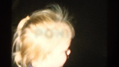 1959: a little girl with blonde hair and a striped shirt CATSKILL GAME FARM
