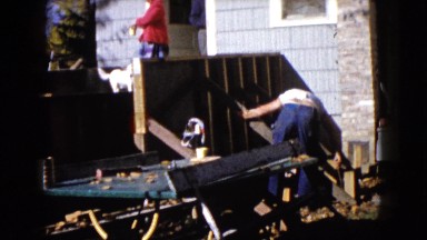 1960: Two Men Building a Fence Next to a House in Wauconda, Illinois