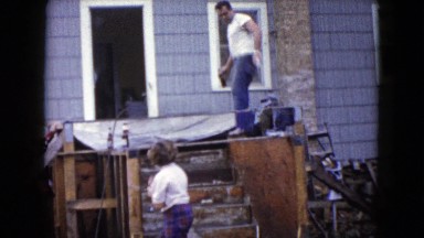 1960: people doing repair work near the house WAUCONDA, ILLINOIS