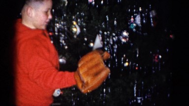 1959: a christmas tree is seen with a child opening presents CATSKILL GAME FARM