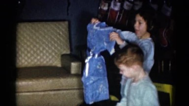 1959: children unwrapping their presents on christmas morning CATSKILL GAME