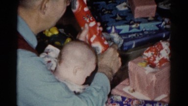 1959: a christmas tree is seen with a child opening presents CATSKILL GAME FARM