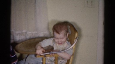 1959: a family at a dining room table with a birthday cake on top CATSKILL GAME