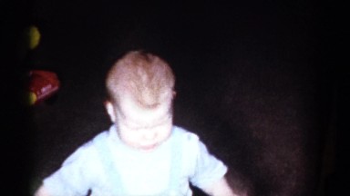 1959: a toddler and a little girl playing on the floor together CATSKILL GAME