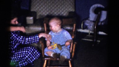 1959: little brother playing with hammer and elder one looks after him CATSKILL